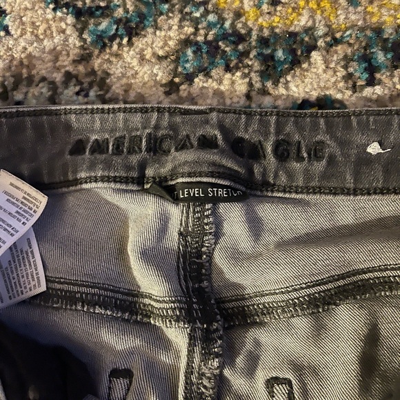 American Eagle Frayed Bottom Holey Grey Jeans - Picture 2 of 2